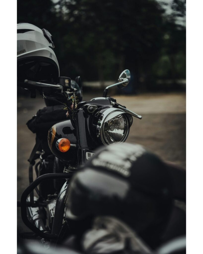 Close-up of a vintage motorcycle with helmet, evoking travel and adventure vibes.